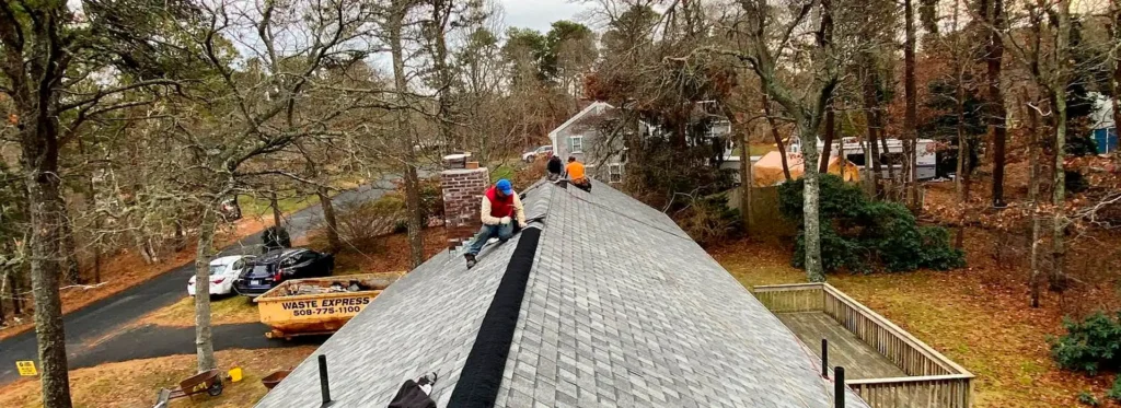 Cape Cod roofers fixing a shingle roof